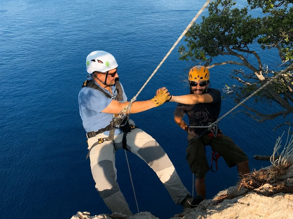 Two participants on a cliff via ferrata