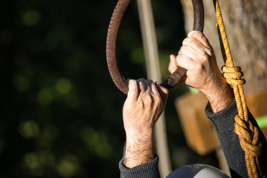Close-up of hands on climbing equipment