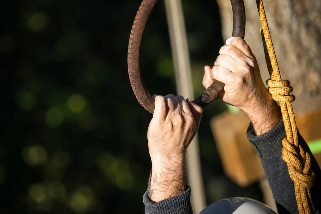 Close-up of hands on climbing equipment