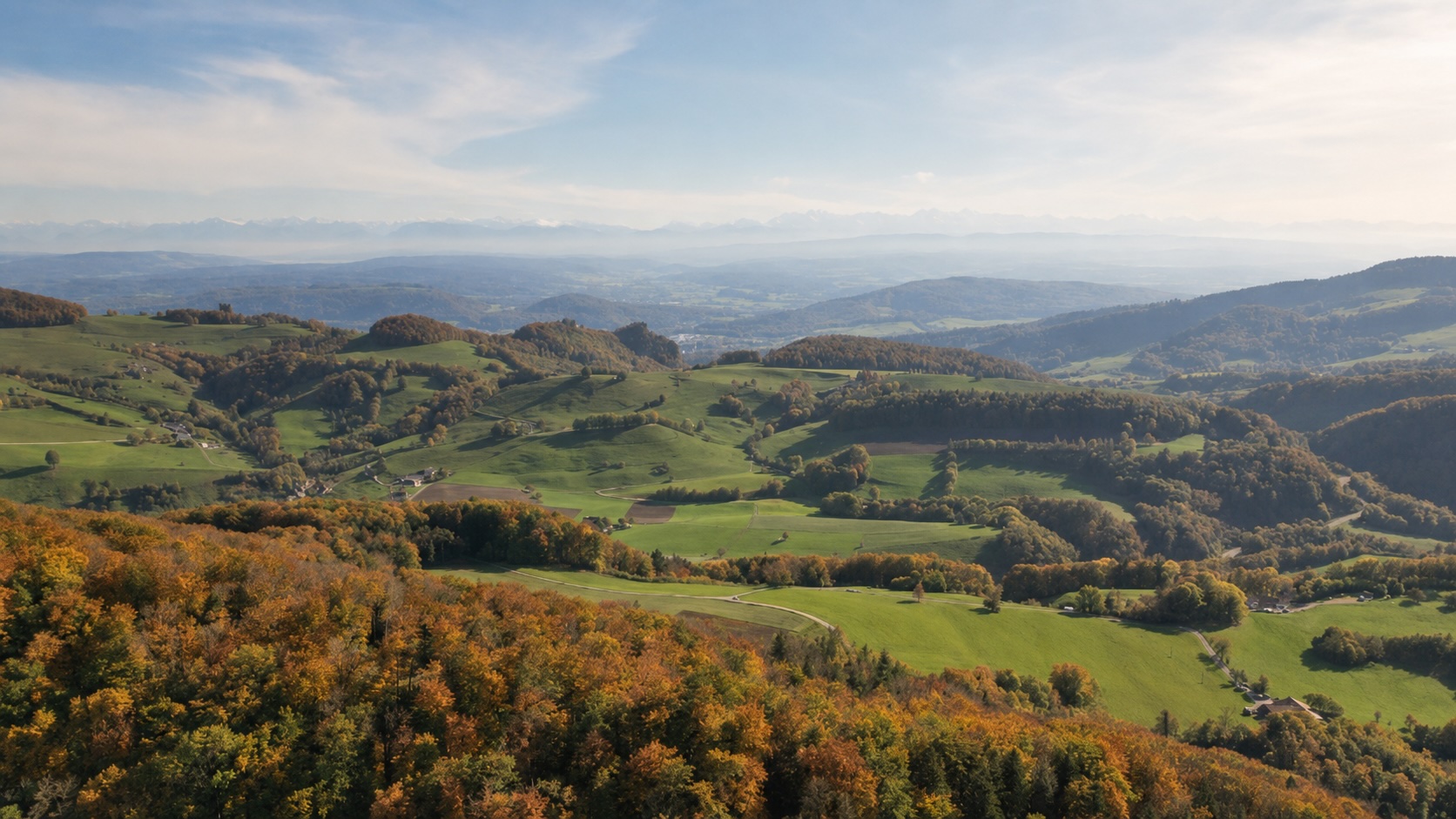 Swiss autumn landscape with Alps in the distance