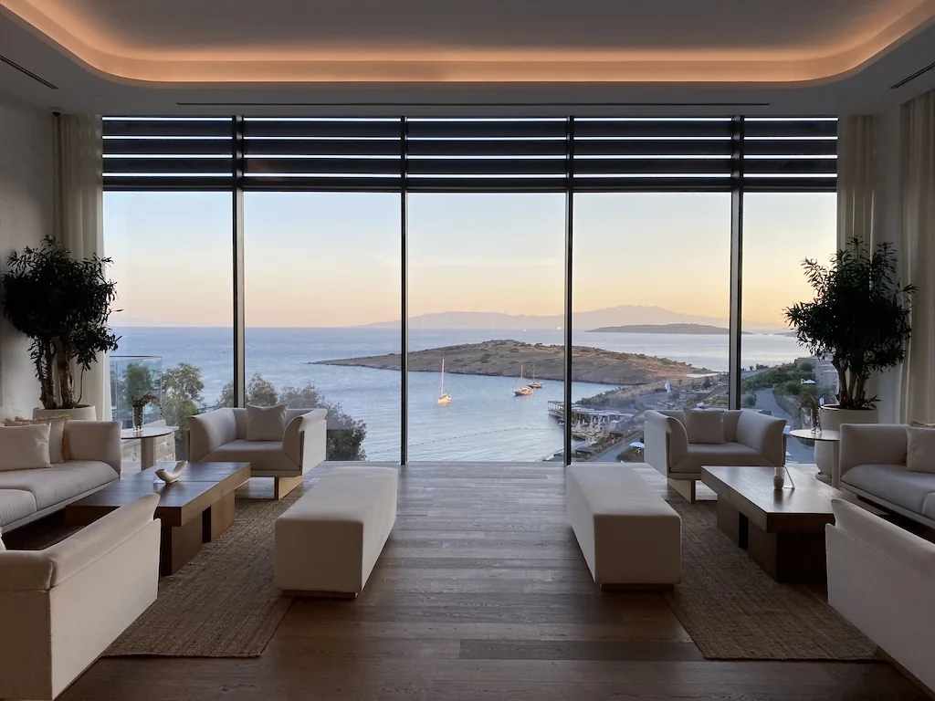 Luxury lounge with panoramic sea view at sunset
